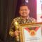 1765472660586-bupati-sumedang-dony-ahmad-munir-saat-menerima-penghargaan-innovatif-government-awards-iga-2025-1765420520932_169