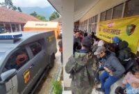 1769511860319-suasana-posko-dvi-polda-jawa-barat-di-desa-pasirlangu-1769506789729_169